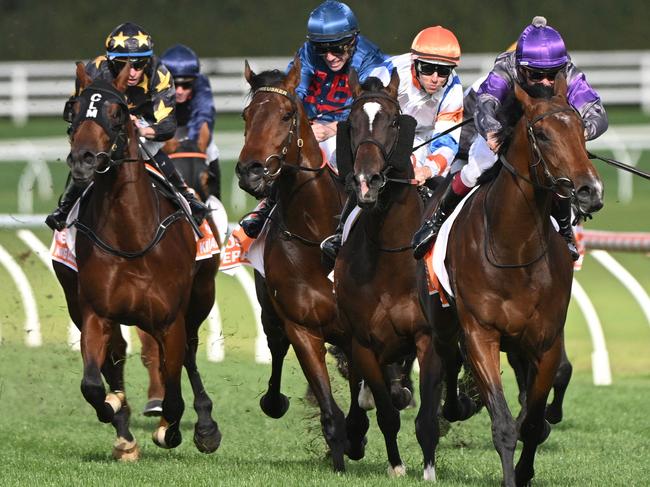 MELBOURNE, AUSTRALIA - OCTOBER 14: Ben Melham riding Griff defeats Damian Lane riding Veight and Steparty in winning Race 9, the Neds Caulfield Guineas, during Melbourne Racing at Caulfield Racecourse on October 14, 2023 in Melbourne, Australia. (Photo by Vince Caligiuri/Getty Images)