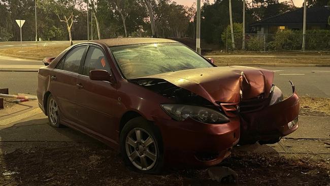 Two people could be seen via CCTV footage fleeing a red Toyota sedan after they crashed it into a fence surrounding a Driver, Palmerston, home.