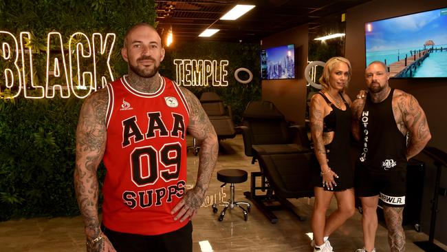 Chris Bowtell at Black Temple Tattoo in Flinders Street with Lutana and Tyrone Gawthorne and Ray White Commercial director Troy Townsend. Picture: Evan Morgan