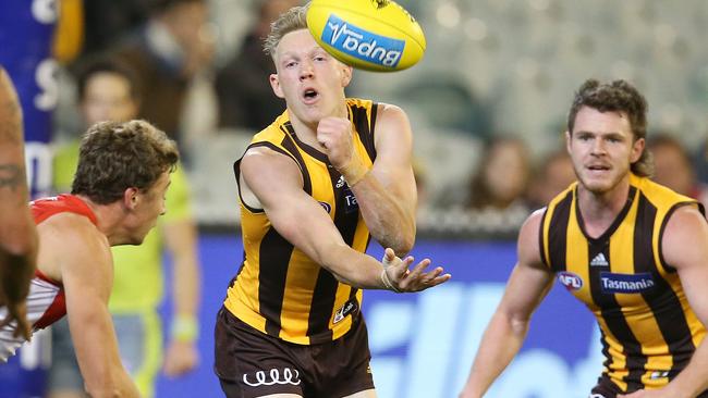 James Sicily gets a handball away. Picture: Michael Klein