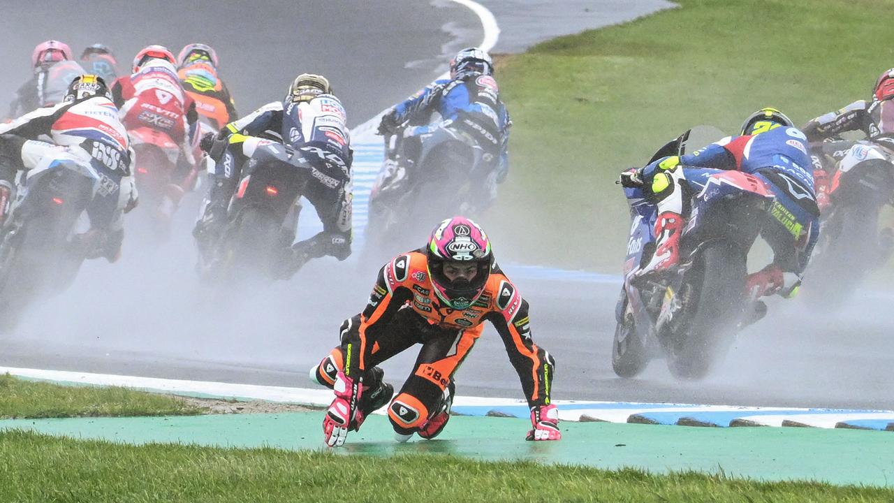 Alonso Lopez crashes out in the early stages of the Moto2 race at the MotoGP Australian Grand Prix in Phillip Island on October 22, 2023. (Photo by Paul CROCK / AFP) / -- IMAGE RESTRICTED TO EDITORIAL USE - STRICTLY NO COMMERCIAL USE --