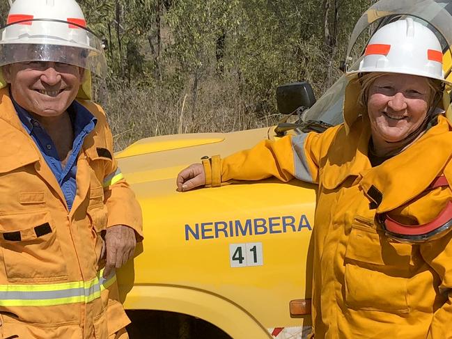 Ian McDonald and Kathleen Ellrott of the Nerimbera Rural Fire Service keep an eye out on the blazes above North Rockhampton