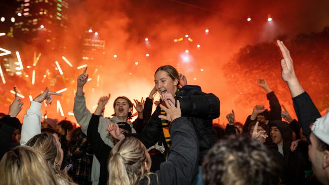 Fans at Federation Square reacts after Australia scorers as they watch the Matildas FIFA World Cup Semi Final Game, on August 16, 2023 in Melbourne, Australia. Picture: Darrian Traynor