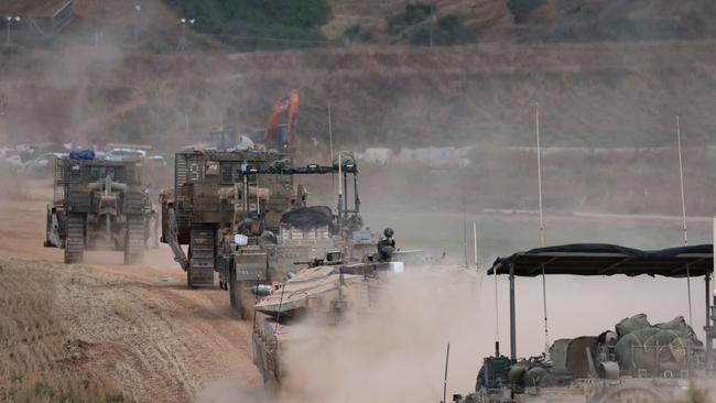 Israeli military vehicles roll near the border with the Gaza Strip at the weekend as the Istraeli Defence Forces deal with both Rafah and re-emergent resistance in previously cleared areas of the Palestinian territory. Picture: Menahem Kahana / AFP