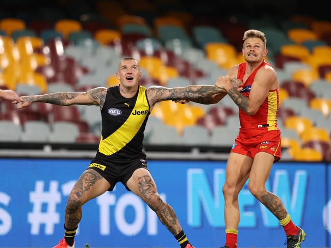 Richmond vs Gold Coast Suns at the Gabba, Brisbane. Ex Tiger now Sun Brandon Ellis and Dustin Martin of the Tigers battle . Pic: Michael Klein