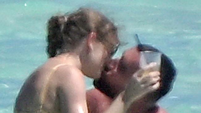 ONE TIME USE ONLY ***FEES APPLY Bahamas, BAHAMAS  -  *PREMIUM-EXCLUSIVE*  -  *WEB EMBARGO UNTIL 2.30 AM on March 27, 2024**Taylor Swift and Travis Kelce live out their Wildest Dreams during first romantic beach getaway together!  After a whirlwind dream for the A-list couple the pair were spotted this week soaking up the sun and quite a bit of PDA in the Bahamas together! Taylor was seen taking a well deserved nap in a pale yellow bikini as Travis at one point was seen getting a drink from a local vendor on the beach. The couple continued their Love Story romance sharing plenty of PDA throughout the day and at one point Travis was spotted resting his hand on Taylor's backside as she napped.  Shot on March 21, 2024  Pictured: Taylor Swift, Travis Kelce  BACKGRID Australia 20 MARCH 2024   Phone: + 61 419 847 429 Email:  sarah@backgrid.com.au