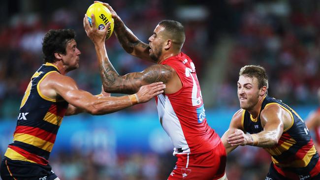 Crows defenders Kyle Hartigan and Daniel Talia pounce on Lance Franklin. Picture. Phil Hillyard