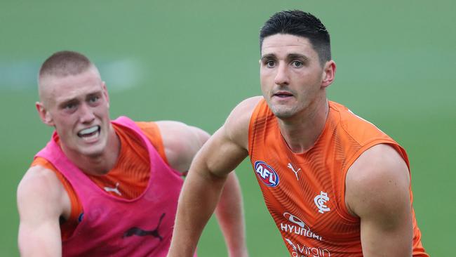 Marc Pittonet clears infront of Callum Moore at Carlton training. Picture: Michael Klein