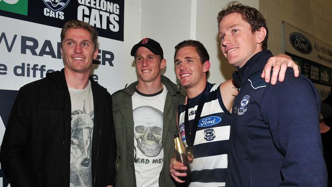 Adam (left), Scott (2nd from left), Joel (2nd from right) and Troy Selwood (right) celebrate after the Cats’ 2011 Grand Final win.