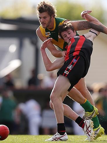 Gippsland Football League Grand Final match between Maffra Eagles and Leongatha Parrots. Maffra became the 2016 premiers, defeating Leongatha 13.10 (88) to 9. 16 (67). Thomas Jolly is grabbed from behind by Jason Tomada. Picture: Yuri Kouzmin