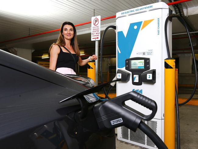 EV driver Michelle Ryan, Director of Bespoke Money Mortgage Broking, charging her vehicle at the Evie Network Charging station inside Indooroopilly shopping centre. Wednesday 25th October 2023 David Clark