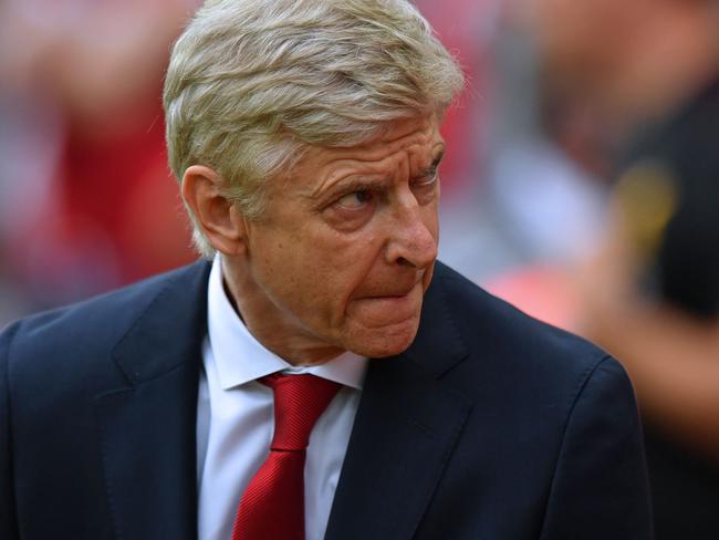 Arsenal's French manager Arsene Wenger takes his seat for the English Premier League football match between Liverpool and Arsenal at Anfield in Liverpool, north west England on August 27, 2017. / AFP PHOTO / Anthony Devlin / RESTRICTED TO EDITORIAL USE. No use with unauthorized audio, video, data, fixture lists, club/league logos or 'live' services. Online in-match use limited to 75 images, no video emulation. No use in betting, games or single club/league/player publications.  /