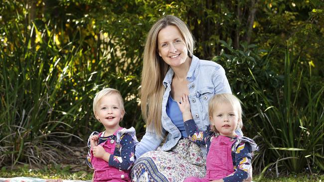 Clarice Davis, with her twin girls Pippa and Gemma Davis, believes in mums carrying twins for as long as health allows. Picture: Josh Woning