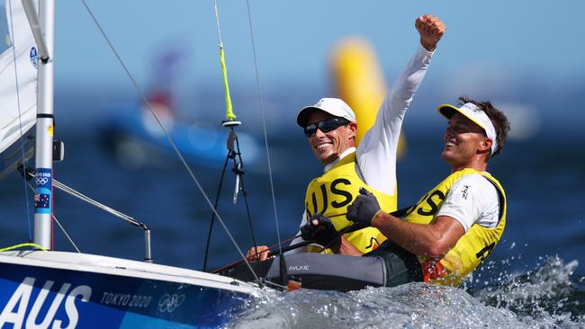 Mathew Belcher, left, and Will Ryan win gold in the Men's 470 class in Fujisawa, Japan, on Wednesday. Picture: Getty Images