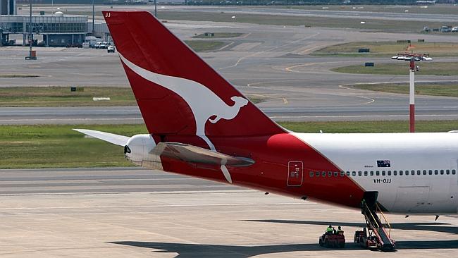 Qantas is set to cut jobs and sell its Melbourne Airport terminal.