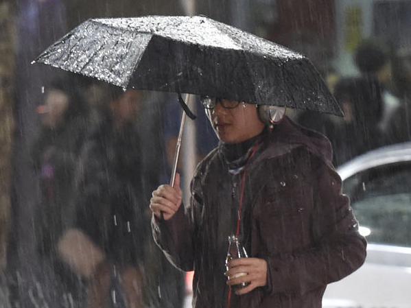 Plenty of people were out and about in Sydney on Saturday night despite the warnings of the rainy weather. The photos are of people walking George St, Albion St (Surry Hills) and Angel Place (near the Ivy nightclub) with umbrellas or clothing covering themselves to escape the rain. Picture: Gordon McComiskie