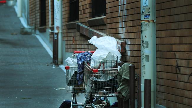 A homeless person sleeps under a trolley in a Southport alleyway. Picture Glenn Hampson.