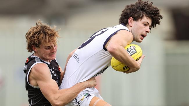 Rebel Nick Hodgson lays a good tackle on Falcon Jak Tute over the weekend. Picture: Martin Keep/Getty Images