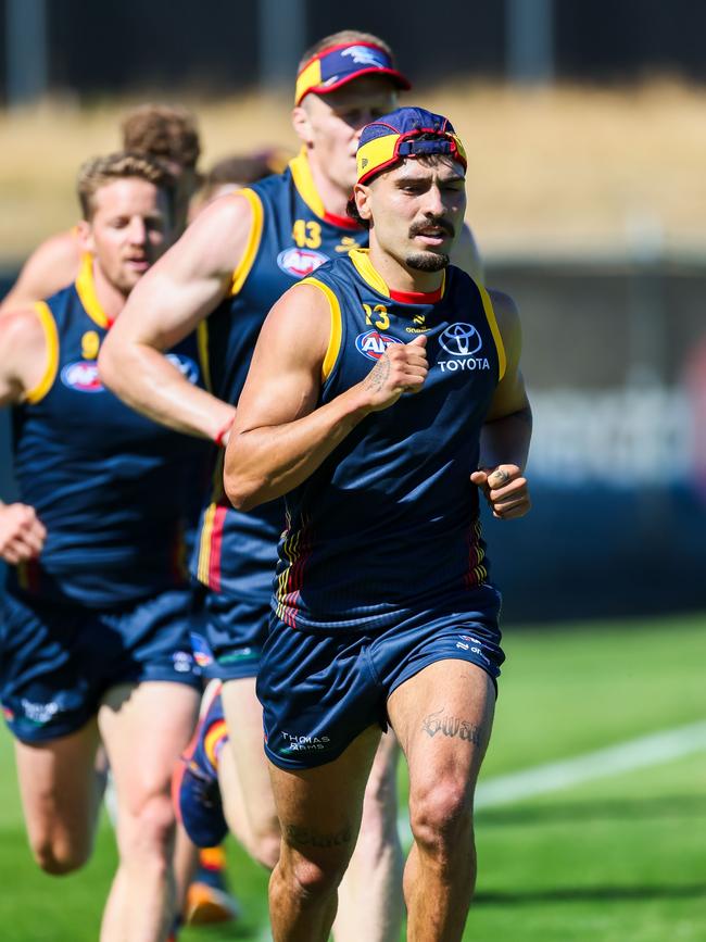 Izak Rankine leading a group running laps. Picture: James Elsby