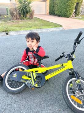 Jett Roberts joy riding his beloved bike without training wheels for the first time