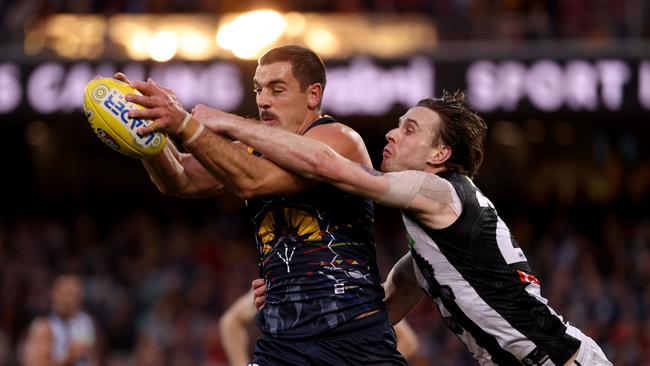 ADELAIDE, AUSTRALIA - JUNE 05: Taylor Walker of the Crows marks against Jordan Roughead of the Magpies during the 2021 AFL Round 12 match between the Adelaide Crows and the Collingwood Magpies at Adelaide Oval on June 5, 2021 in Adelaide, Australia. (Photo by James Elsby/AFL Photos via Getty Images)