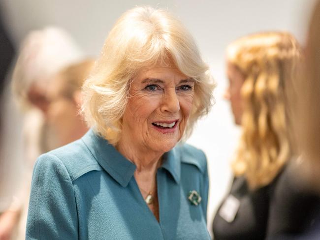 Britain's Queen Camilla (C) talks with volunteers and visitors to the centre after officially opening 'Maggie's Royal Free', a new cancer support centre, at the Royal Free Hospital in east London on January 31, 2024. (Photo by Paul Grover / POOL / AFP)