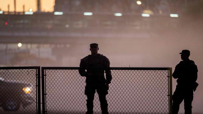 National Guard soldiers on the banks of the Rio Grande river. (Photo by Brandon Bell / GETTY IMAGES NORTH AMERICA / Getty Images via AFP)