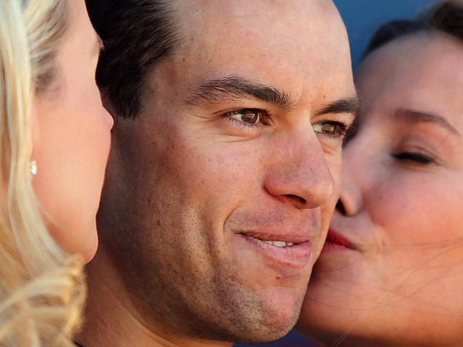 ADELAIDE, AUSTRALIA - JANUARY 25: Australian cyclist Richie Porte of Team Sky celebrates after being presented with a trophy for winning Stage Five of the Tour Down Under on January 25, 2014 in Adelaide, Australia. (Photo by Morne de Klerk/Getty Images)