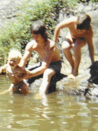 Ray, who was shot when Mark was eight, with his young son.