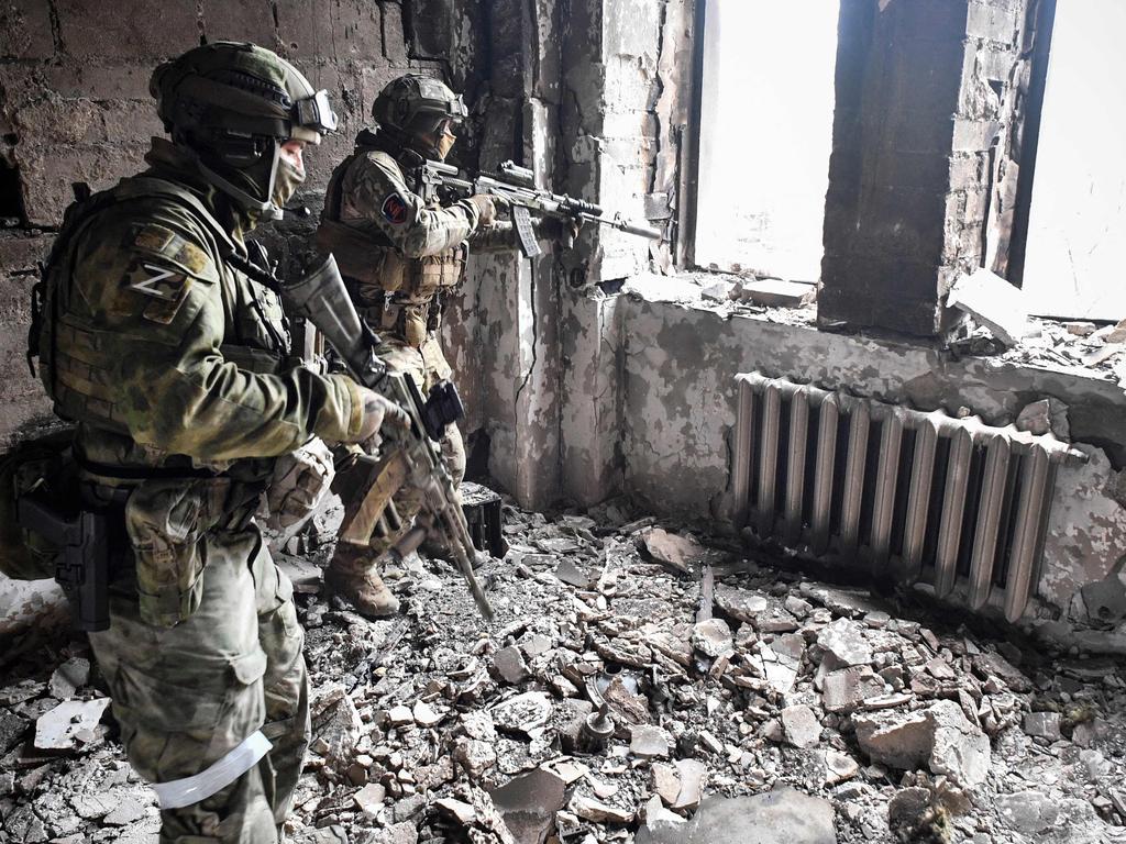 Russian soldiers patrol in the Mariupol drama theatre, bombed on March 16. Picture: AFP