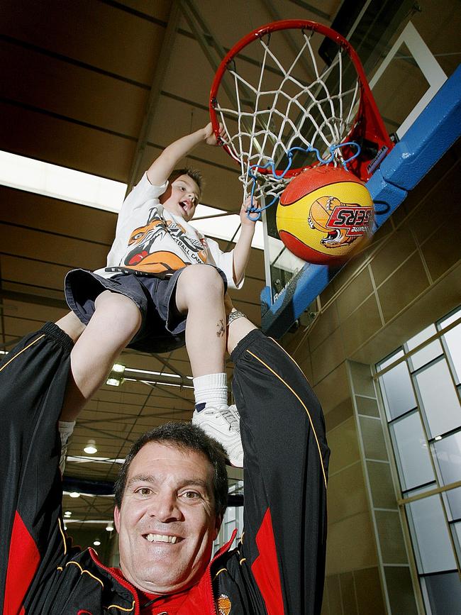 Josh Giddey, 4, as a young basketball hopeful with his father and future Tigers coach Warrick Giddey. Pic. Glenn Daniels.