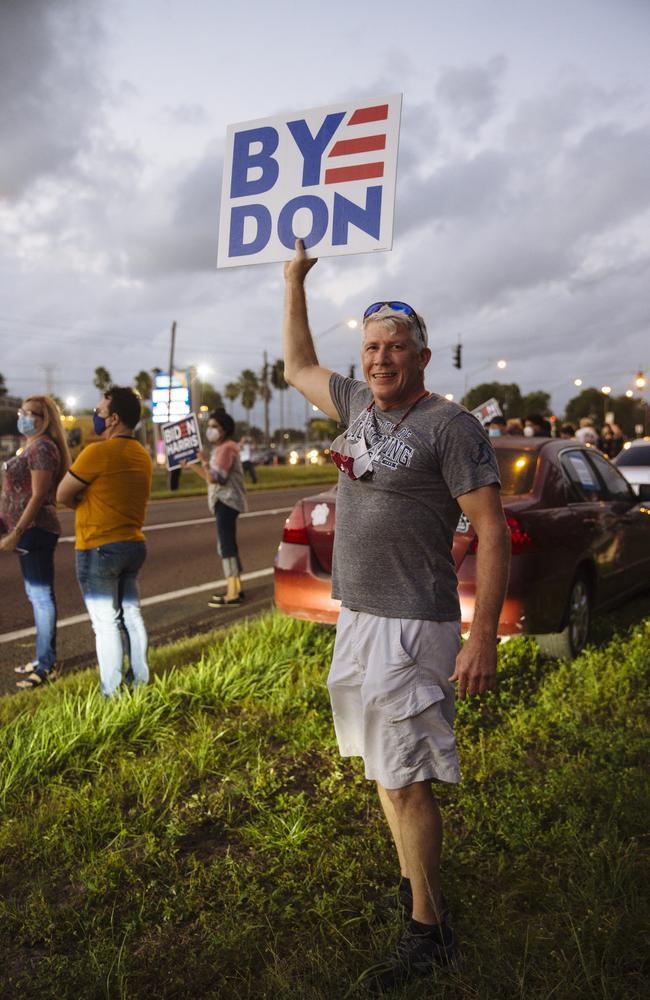 Will Coyner, an accountant, held a sign saying “Bye Don!” outside the Biden show. Picture: Angus Mordant