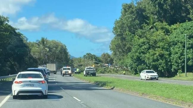 A tree has fallen on the Captain Cook Hwy northbound lane at Aeroglen, causing delays. Picture: Pete Carruthers