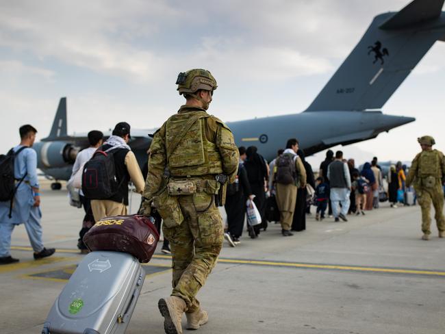 Australian citizens and visa holders board a flight out of Kabul. The Morrison government has committed to 3000 places for Afghan refugees, but Christian church leaders wants 20,000. Picture: Supplied