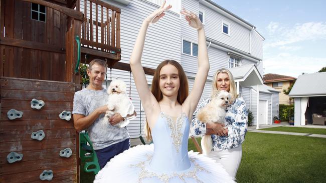 Mark and Marcelle Small with their daughter Elleisha, 12, are selling their home in sought-after Mermaid Beach. The family moved to the area more than a decade ago for its villagey feel and proximity to the beach. Picture: Tertius Pickard