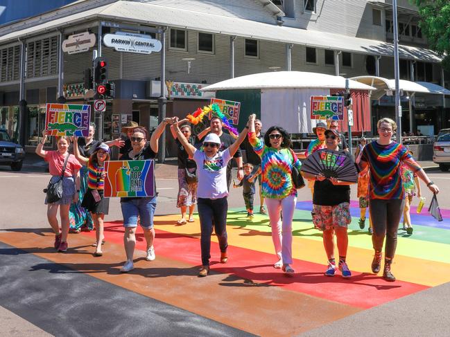 Local Pride Representatives celebrate The Pride Rainbow on Knuckey Street has been resurfaced and is now more vivid. Picture: Glenn Campbell