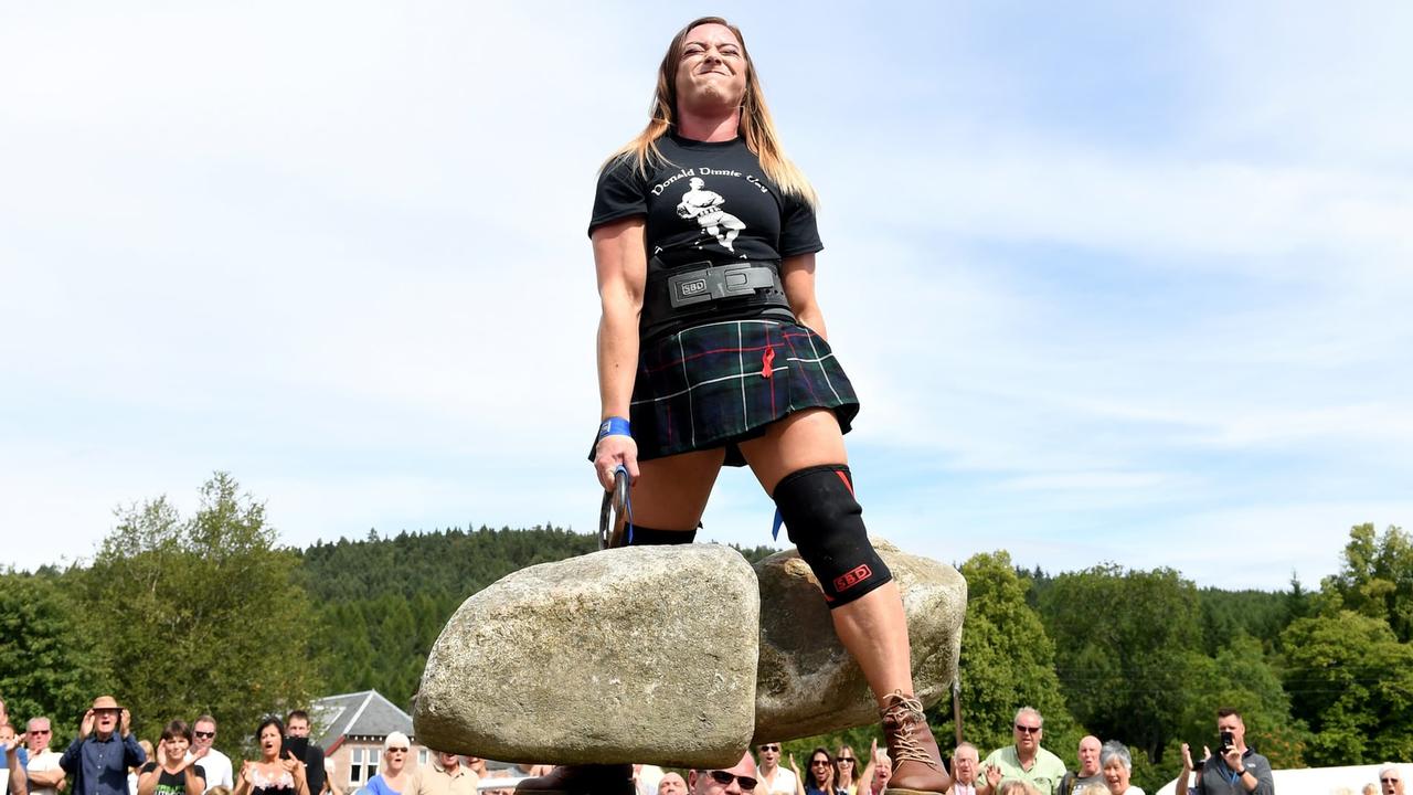 Leigh Holland-Keen lifts the Dinnie stones. Picture: Cascade News