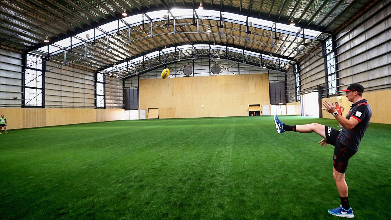 Brendon Goddard kicks a football in the indoor training room at Essendon’s Tullamarine training facility.