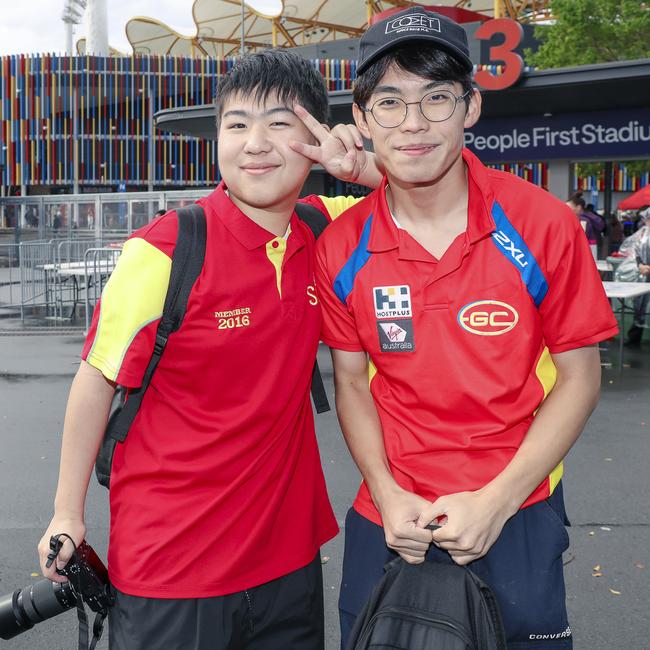 Japanese exchange students Ao and Kieshi before the Suns V Freo at People First Stadium Cararra. Picture: Glenn Campbell