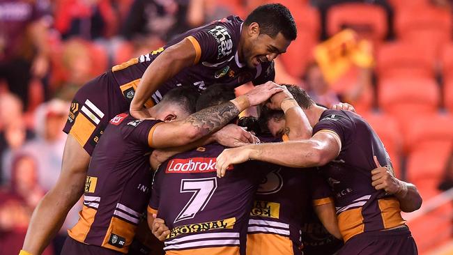 Broncos players celebrate Jamayne Isaako’s match-sealing try on Friday night.