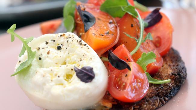 Tomatoes, pickled nectarines, burrata and basil. Photo by Richard Gosling