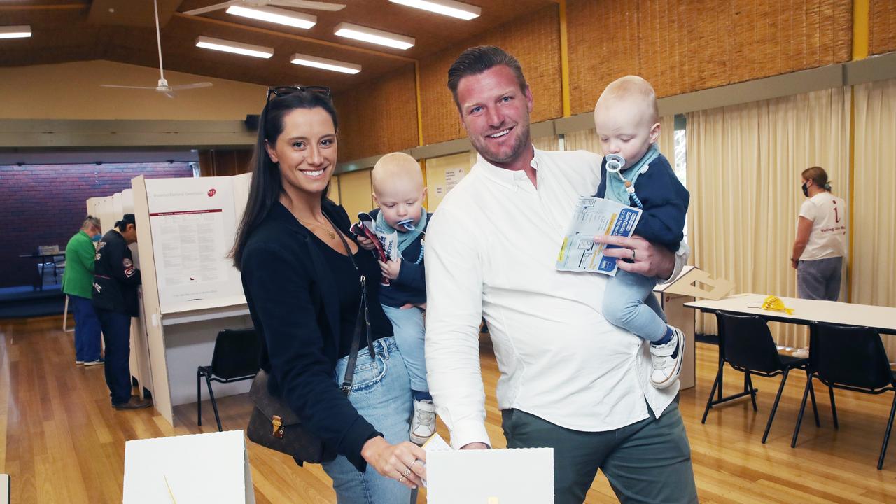 Sam Groth voting with wife Brittany and twins Mason and Parker at Blairgowrie on Saturday. Picture: David Crosling