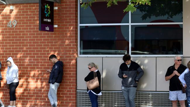 Thousands of people lined up outside Centrelink offices this week – but maintained their social distancing. Picture: AAP / Kelly Barnes