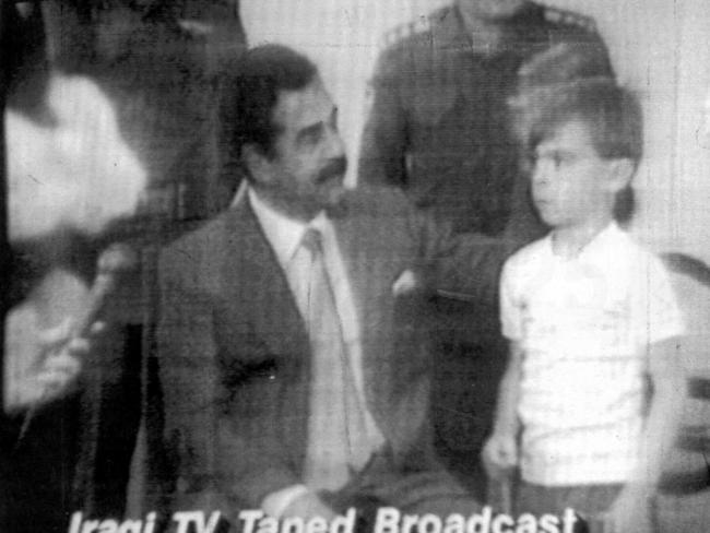 Chilling: Iraqi President dictator Saddam Hussein pats the head of a young British hostage on television after the invasion of Kuwait by Iraq in August 1990.