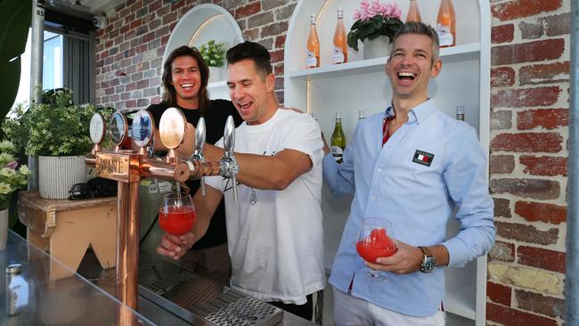 The Stafford brothers Mark and Chris with operator Matthew Keegan behind the bar at the new Surfers Pavilion. Picture Glenn Hampson