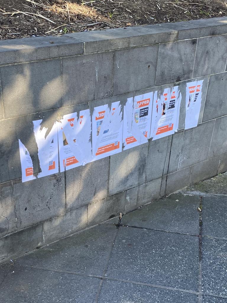 Posters showing Israeli hostages have been torn down in Melbourne.