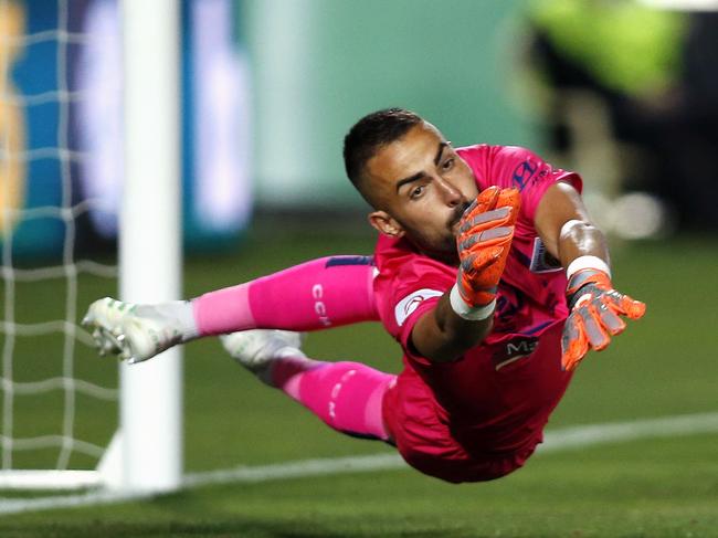 Central Coast Mariners Mark Birighitti takes a save in the A-League match against the Newcastle Jets on Saturday.