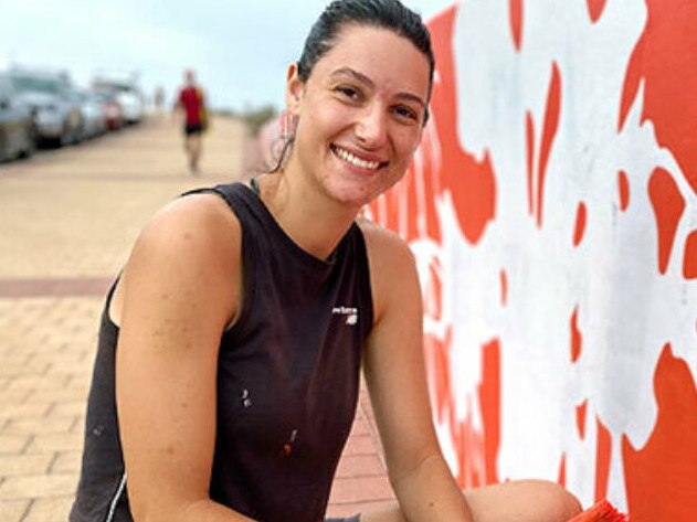 Local artist Alex Bellas painting the mural along the Glenelg Esplanade, which caused a stir among local residents. Picture: City of Holdfast Bay