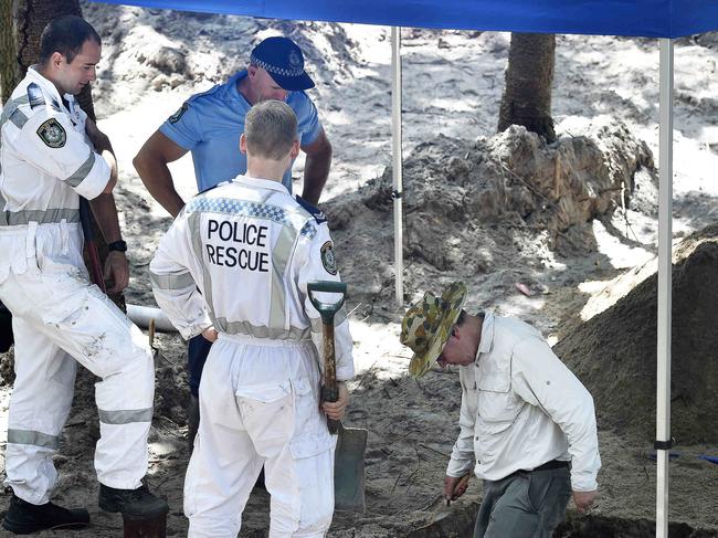 Archaeologist Tony Cowe with police digging in bushland near Magenta in 2015 searching for any sign of Mr Penn.