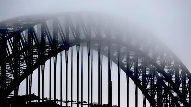 SYDNEY, AUSTRALIA - NCA NewsWire Photos - 05 JULY, 2023: The Sydney Harbour Bridge is pictured as blanket of fog rolls over Sydney on Wednesday morning, ahead of a big snow dump due to hit the Alpine regions later this week.. Picture: NCA NewsWire / Nicholas Eagar